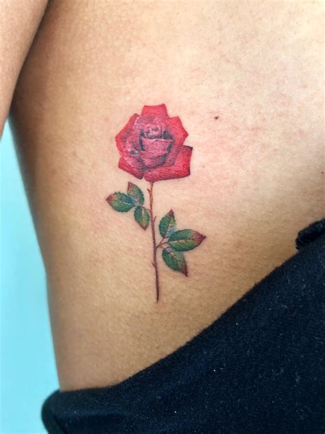 small rose tattoo between breast|Top 10 rose between breast tattoo ideas and inspiration